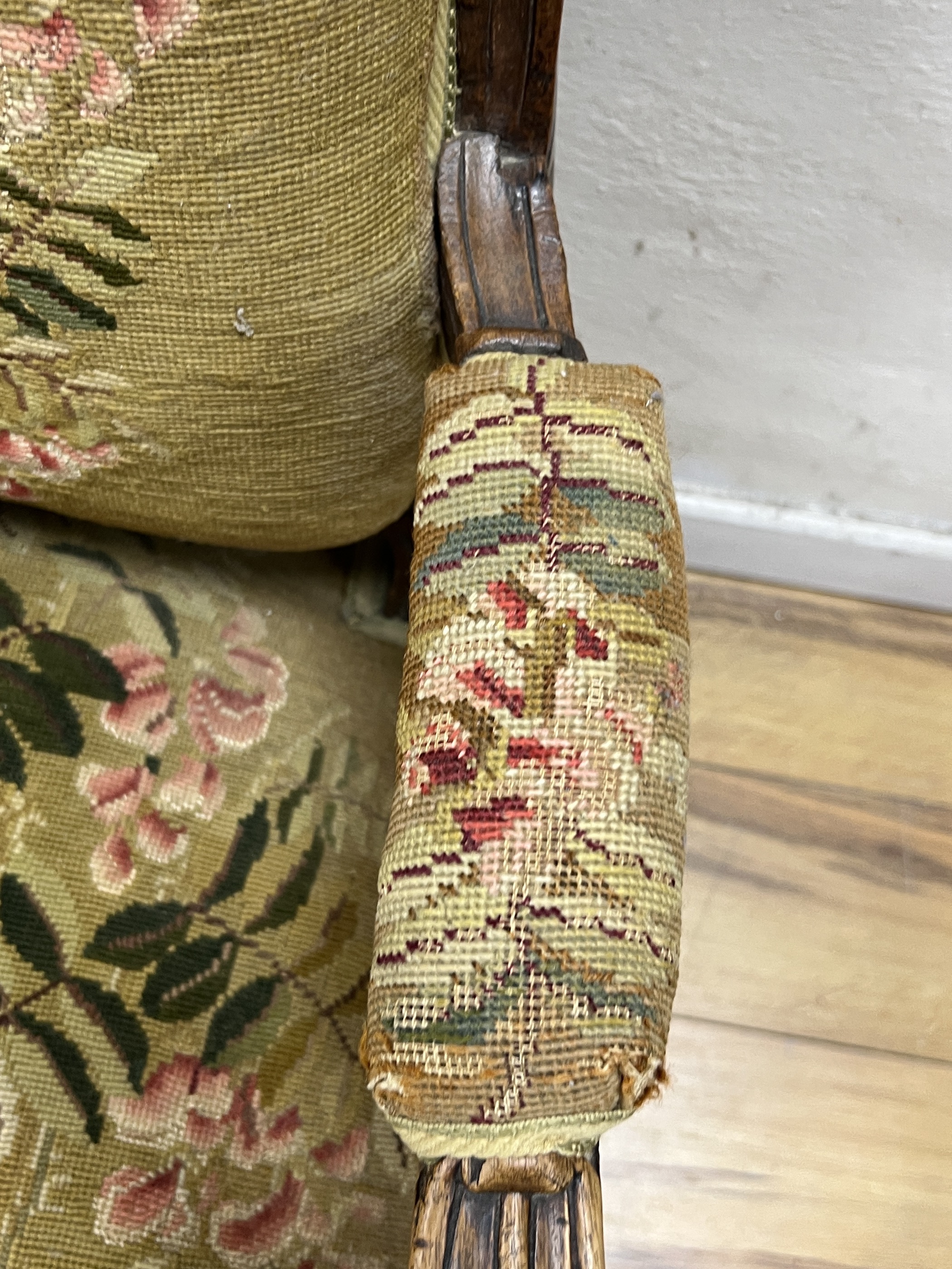 A French carved walnut tapestry fauteuil, width 64cm, depth 64cm, height 96cm